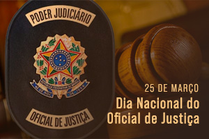 Foto de uma carteira do oficial de justiça com os dizeres Poder Judiciário Oficial de Justiça. Ao lado a menção do dia 25 de março, dia nacional do Oficial de Justiça
